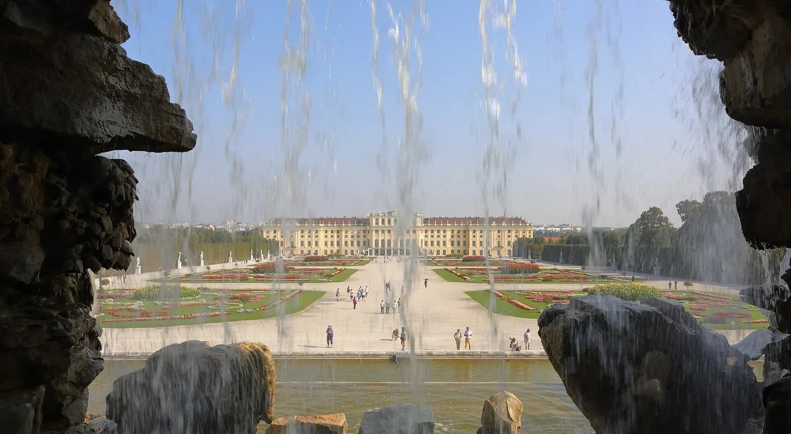 Photo: Martin Falbisoner, CC BY-SA 4.0 Schonbrunn Palace from the Neptune Fountain, Vienna